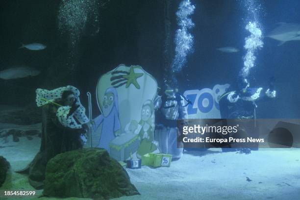 Divers dressed as the Three Wise Men next to the Shark Nativity Scene at the Madrid Zoo, on 14 December, 2023 in Madrid, Spain. Zoo de Madrid carries...