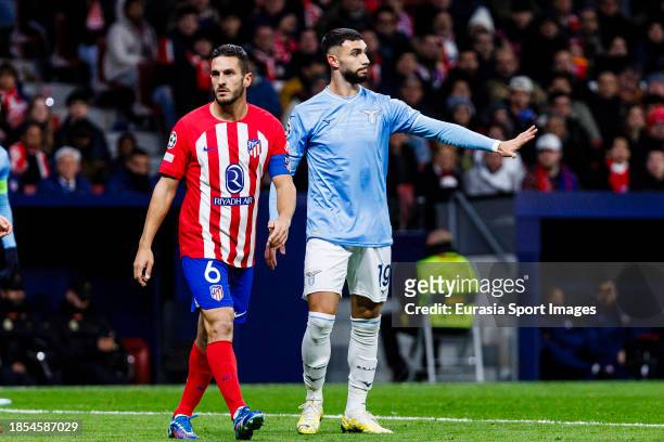 Koke of Atletico de Madrid and Taty Castellanos of Lazio walking in the field during the UEFA Champions League Group Stage match between Atletico...