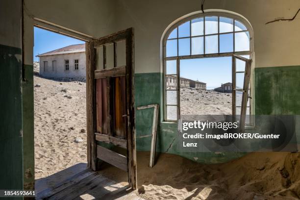 ruins of the former hospital, kolmanskop, ghost town, diamond town, luederitz, namibia - kolmanskop namibia stock pictures, royalty-free photos & images