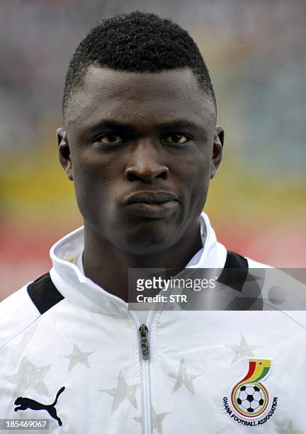 Ghana's defender Rashid Sumaila listens on October 15, 2013 to his national anthem prior to the kick off of the Fifa World Cup 2014 qualifying...