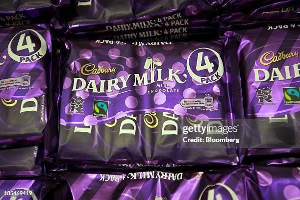 Multi-pack bars of Cadbury "Dairy Milk" chocolate, manufactured by Kraft Foods Inc., sit displayed for sale inside an Asda supermarket, the U.K....