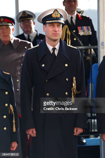 Prince William, Prince of Wales stands to attention during a visit to The Lord High Admiral's Divisions at Britannia Royal Naval College on December...