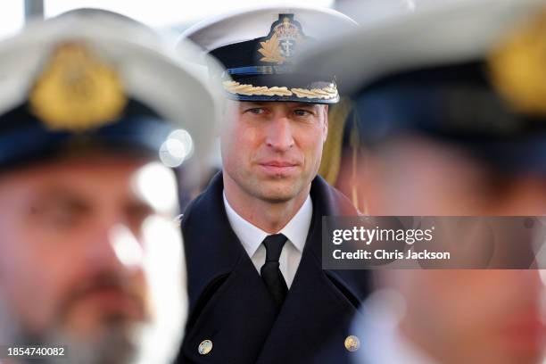 Prince William, Prince of Wales stands to attention during a visit to The Lord High Admiral's Divisions at Britannia Royal Naval College on December...