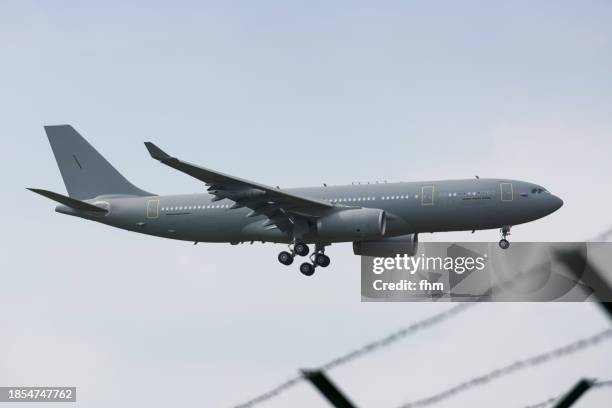 military transporter aircraft arrives the airport - transporter stock pictures, royalty-free photos & images