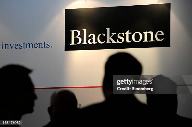 The logo for Blackstone Group LP is displayed during the opening of the company's new office in Singapore, on Monday, Oct. 21, 2013. Blackstone, the...