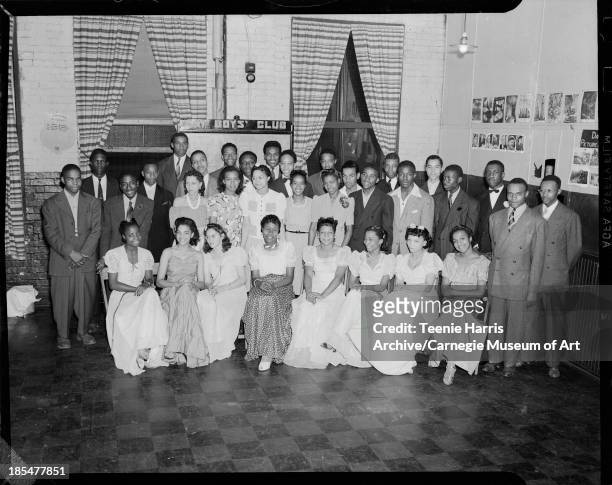 Group portrait gathered in Kay Boys Club, Pittsburgh, Pennsylvania, 1941. Including, seated from left: Marie Russell, Doris Corsey, Helen Davis,...