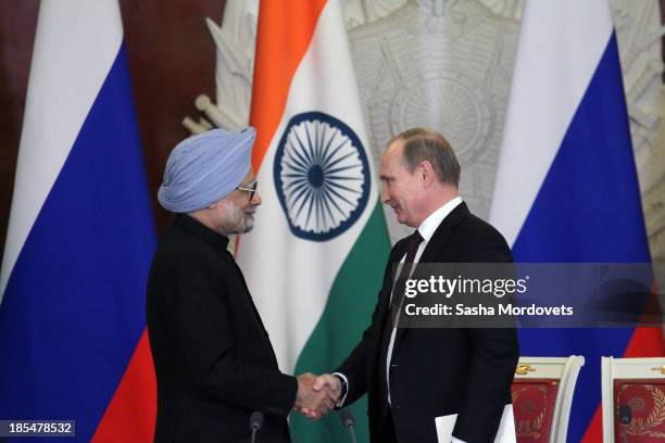 Russian President Vladimir Putin shakes hands with Indian Prime Minister Manmohan Singh during their bilateral meeting in the Kremlin on October 21,...