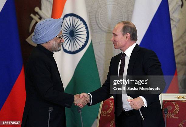 Russian President Vladimir Putin shakes hands with Indian Prime Minister Manmohan Singh during their bilateral meeting in the Kremlin on October 21,...