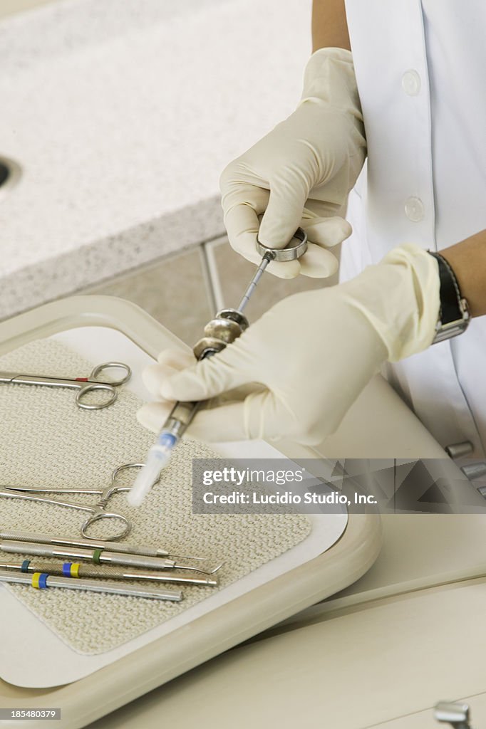 Dentist preparing local anesthetic