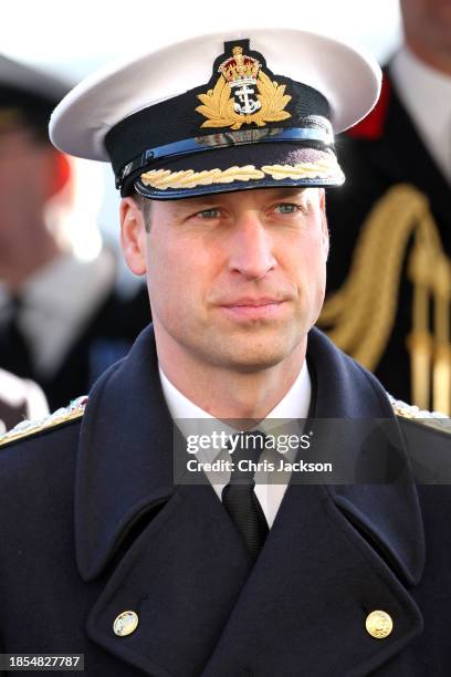 Prince William, Prince of Wales stands to attention during a visit to The Lord High Admiral's Divisions at Britannia Royal Naval College on December...