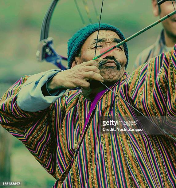 old archer - bhutan archery stock pictures, royalty-free photos & images