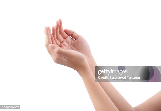 hand holding something ,alms-giving female empty hands or presenting something. outstretched cupped arms - receiving hands stock pictures, royalty-free photos & images