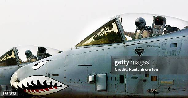 Warthog pilots go through their pre-flight checks in the cockpit before takeoff on the flight line at an air base in the Arabian Gulf near the Iraqi...