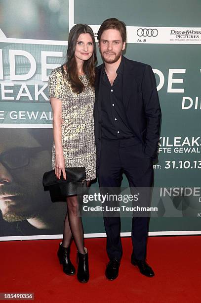 Felicitas Rombold and Daniel Bruehl attend the 'Inside Wikileaks' Germany Premiere at Kulturbrauerei on October 21, 2013 in Berlin, Germany.