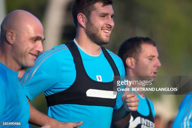 Marseille's French forward Andre-Pierre Gignac takes part in a training session on the eve of the UEFA Champions League group F football match...