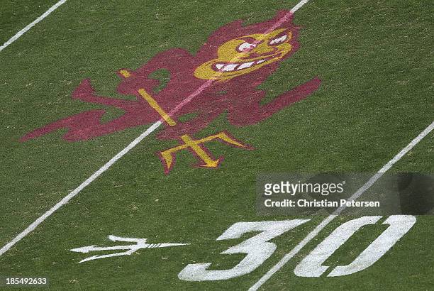 The Arizona State Sun Devils logo is displayed on the field during the college football game against the Washington Huskies at Sun Devil Stadium on...