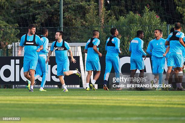 Marseille's French forward Andre-Pierre Gignac, Marseille's French midfielder Mathieu Valbuena and teammates take part in a training session on the...