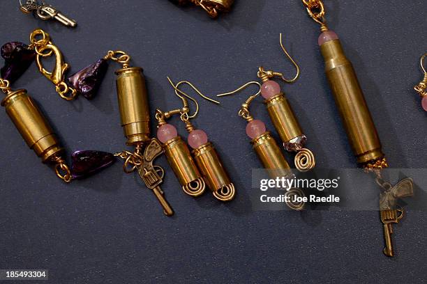 Some of the bracelets, earrings and necklaces are seen that Susan Kushlin's company, Gun Girls, Inc., created for women that enjoy guns on October...