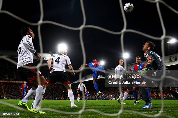Adrian Mariappa of Crystal Palace rises above the Fulham defence to score the opening goal during the Barclays Premier League match between Crystal...
