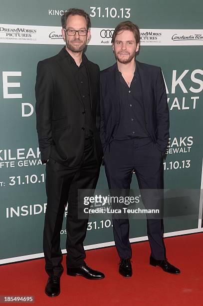 Daniel Bruehl and Daniel Domscheit-Berg attend the 'Inside Wikileaks' Germany Premiere at Kulturbrauerei on October 21, 2013 in Berlin, Germany.