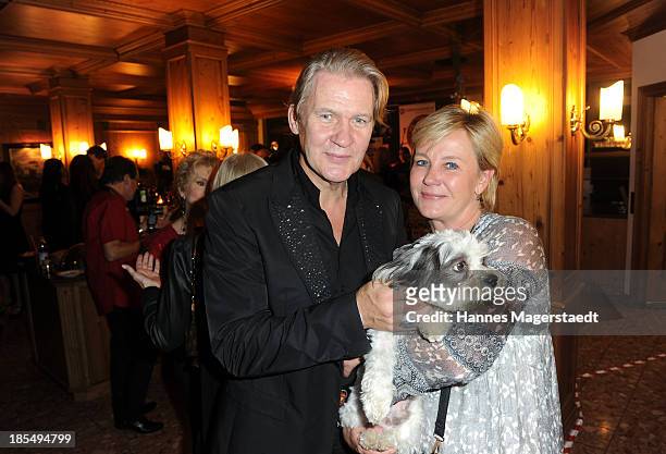 Singer Johnny Logan and his girlfriend Tanja Surmann with their dog Balu attend the presentation of Manfred Baumann New Calendar 2014 at the King's...