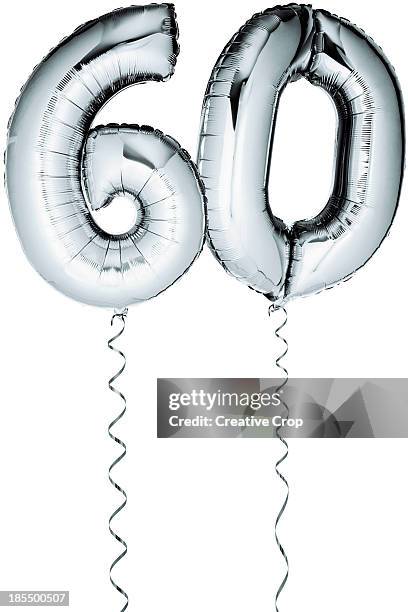 silver balloons in the shape of a number 60 - number 60 stockfoto's en -beelden