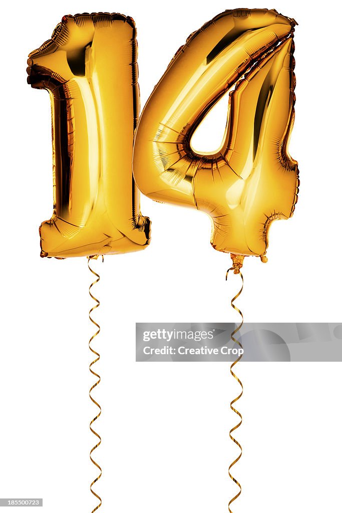 Gold balloons in the shape of a number 14