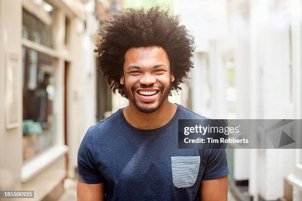 portrait of young man - afro frisur stock-fotos und bilder