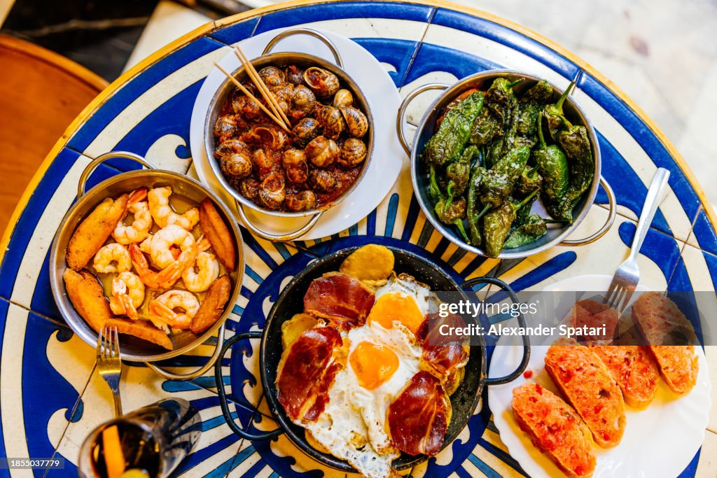 Dinner with traditional Spanish dishes at the restaurant in Barcelona, Spain