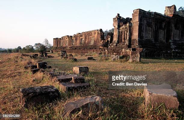 Dawn over the ruins of the magnificent Hindu Khmer temple of Wat Phu in Champassak Province, Laos. Historians claim that the temple was built as...