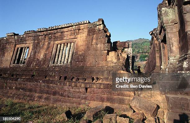 The ruins of the magnificent Hindu Khmer temple of Wat Phu in Champassak Province, Laos. Historians claim that the temple was built as early as the...