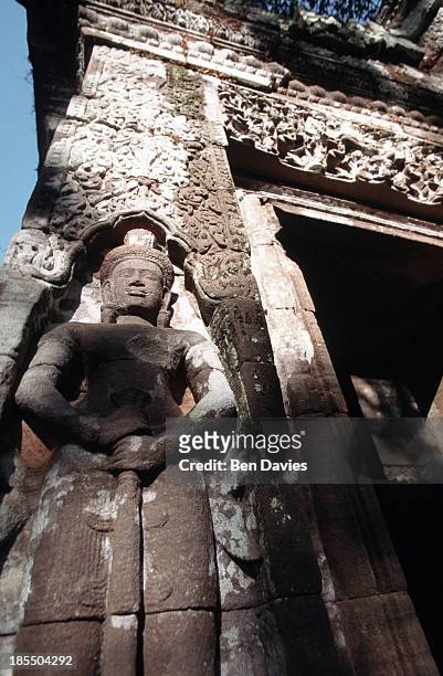 Detail of an intricate stone carving found in the ruins of the Hindu Khmer temple of Wat Phu in Champassak Province, Laos. Historians claim that the...