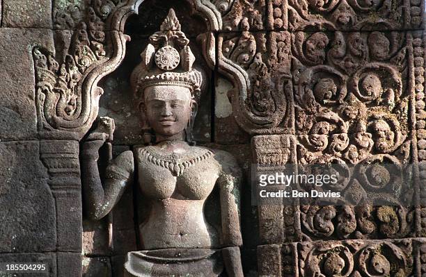 Detail of an intricate stone carving found in the ruins of the Hindu Khmer temple of Wat Phu in Champassak Province, Laos. Historians claim that the...