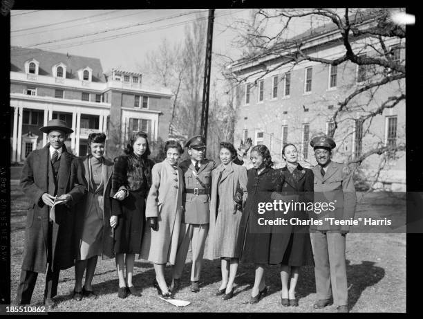 Group portrait, standing on lawn at Hampton Institute, Hampton, Virginia, 1940. From left: Leo Robinson, Vera Lewis, D. Charmaine Jeffries, Hattie...