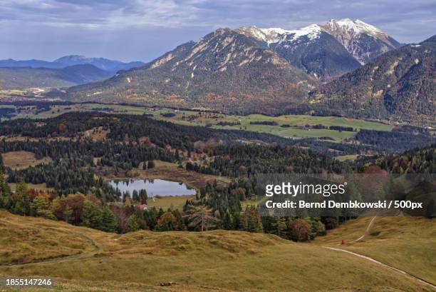 scenic view of landscape and mountains against sky - bernd dembkowski stock-fotos und bilder