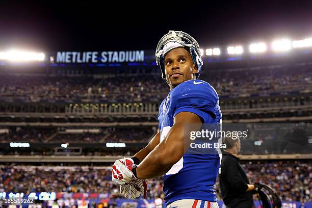 Wide receiver Victor Cruz of the New York Giants looks on before the start of the second half against the Minnesota Vikings during a game at MetLife...
