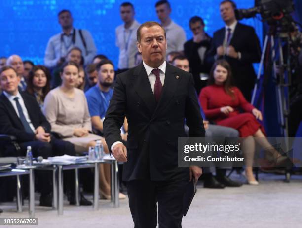 Russian State Council's Deputy Chairman Dmitry Medvedev enters the scene during the 21th Congress of the United Russia Party, on December 17, 2023 in...