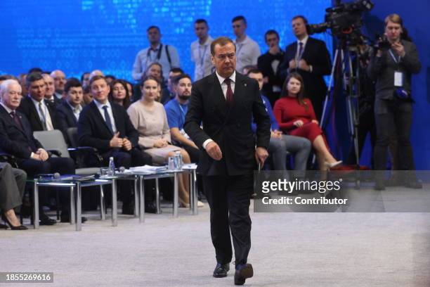 Russian State Council's Deputy Chairman Dmitry Medvedev enters the scene during the 21th Congress of the United Russia Party, on December 17, 2023 in...