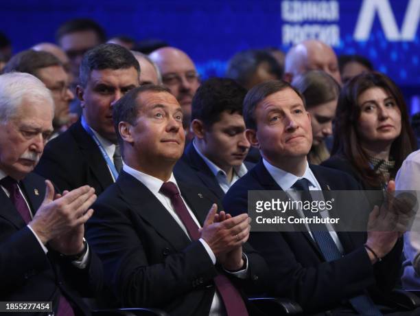 Russian State Council's Deputy Chairman Dmitry Medvedev and senator Andrei Turchak applaud during the 21th Congress of the United Russia Party on...