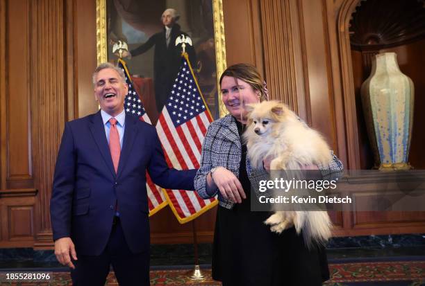 Former Speaker of the House Kevin McCarthy poses for a photo with a Congressional staffer and their dog on his last day at the U.S. Capitol on...