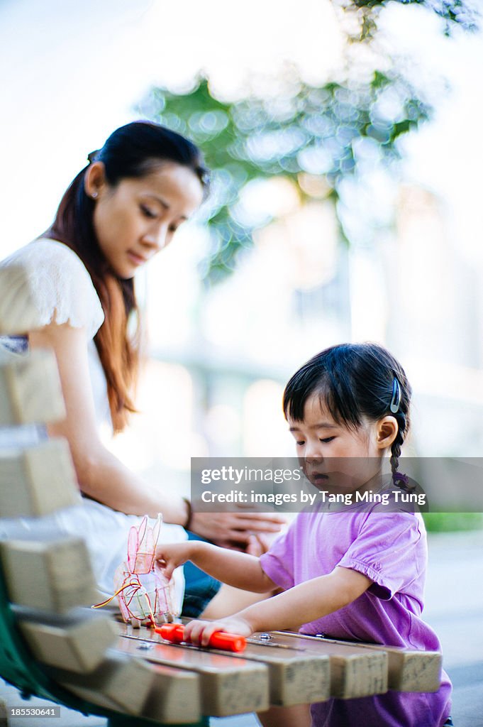 Toddler playing traditional chinese rabbit lantern