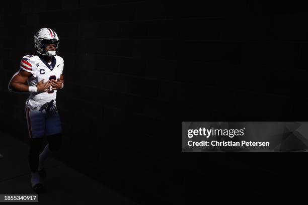 Running back Michael Wiley of the Arizona Wildcats walks out to the field before the NCAAF game against the Arizona State Sun Devils at Mountain...