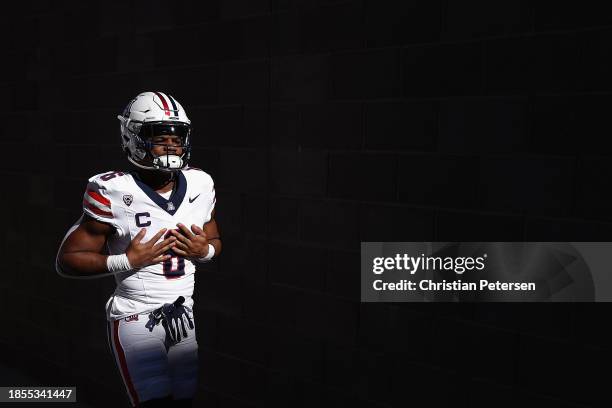 Running back Michael Wiley of the Arizona Wildcats walks out to the field before the NCAAF game against the Arizona State Sun Devils at Mountain...