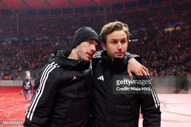 Robin Gosens and Frederik Roennow of 1. FC Union Berlin react after the UEFA Champions League match between 1. FC Union Berlin and Real Madrid CF at...