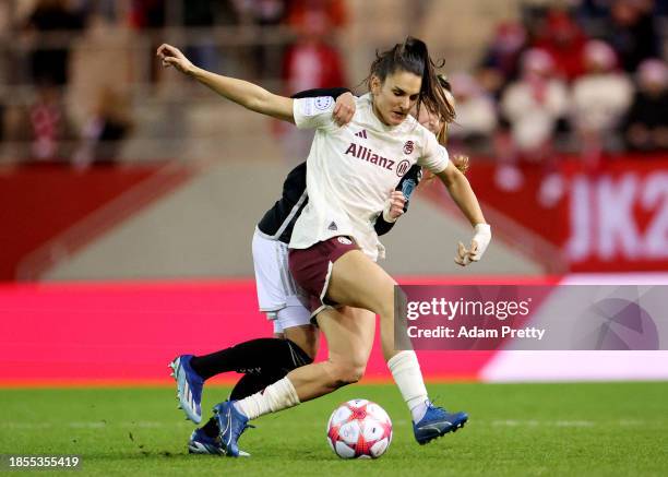 Danique Tolhoek of Ajax challenges for the ball with Jovana Damnjanovic of Bayern Munich during the UEFA Women's Champions League group stage match...