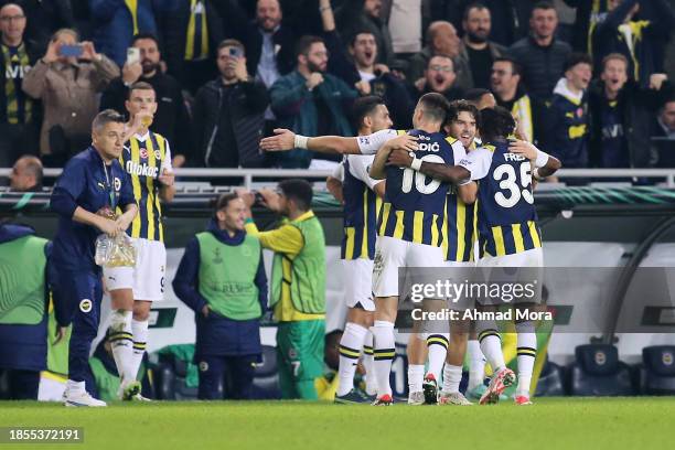 Ferdi Kadioglu of Fenerbahce celebrates with teammates after scoring their team's first goal during the UEFA Europa Conference League match between...