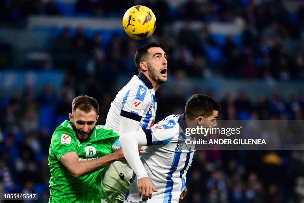 Real Betis' Argentinian defender German Pezzela , Real Sociedad's Spanish midfielder Mikel Merino and Real Sociedad's Portuguese forward Andre Silva...