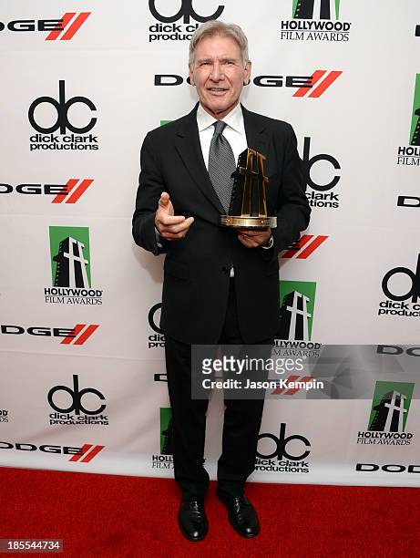 Harrison Ford poses with the award for Hollywood Career Achievement in the press room during the 17th annual Hollywood Film Awards at The Beverly...