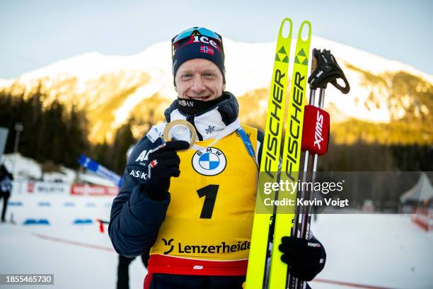 Johannes Thingnes Boe of Norway celebrates after the medal ceremony for winning the Men 15 km Mass Start at the BMW IBU World Cup Biathlon...