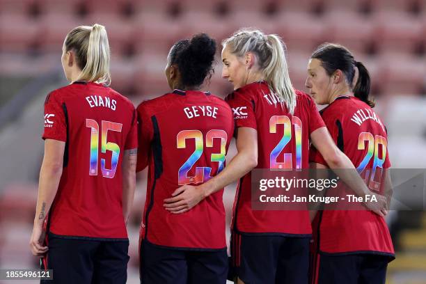 Gemma Evans, Geyse, Millie Turner and Rachel Williams of Manchester United prepare to defend a free-kick whilst wearing rainbow coloured numbers...